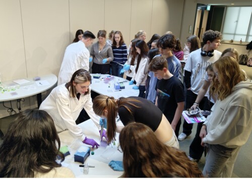 students watching a biology Experiment