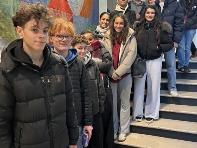 french students standin gon the staircase at the french cinema