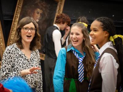 Drama Teacher with two students dressed as schoolgirls
