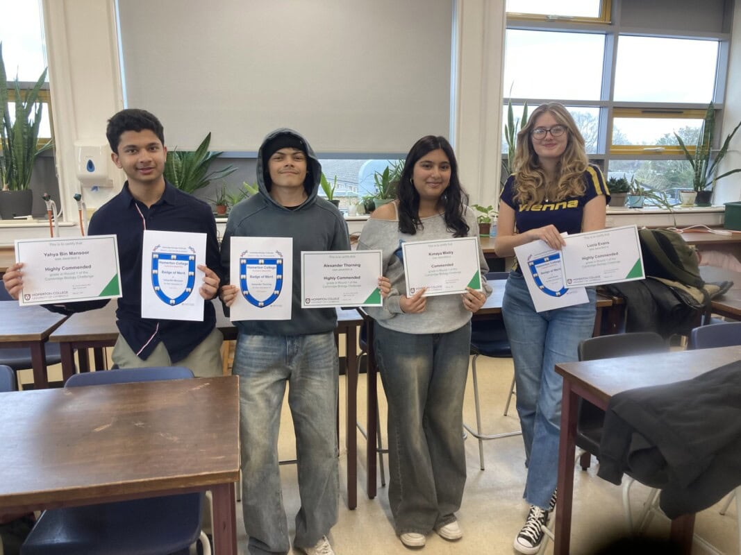 Biology students holding a certificate