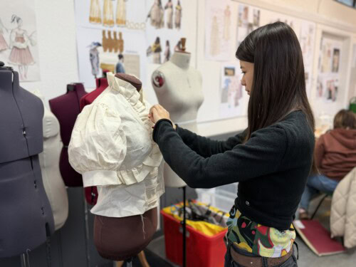 fashion student Kin Yee working at a mannequin