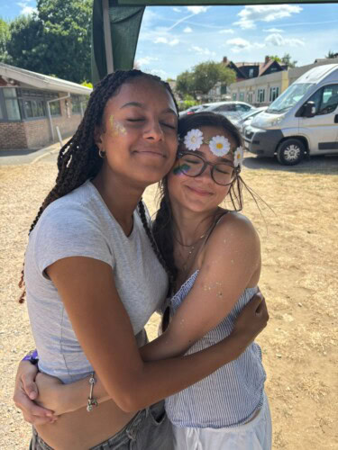 the SU hugging at the summer festival