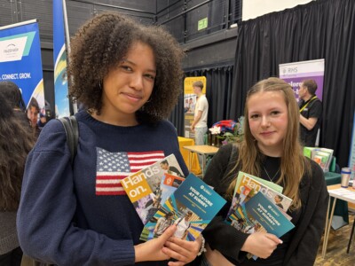 two female students holding prospectuses at the Apprenticeship fair