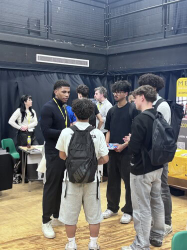 Maurice Talking With Students