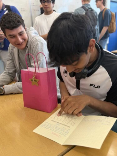 maths student reading a thank you card