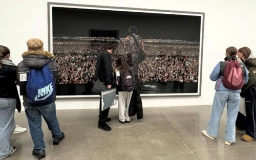 Art students standing in a gallery