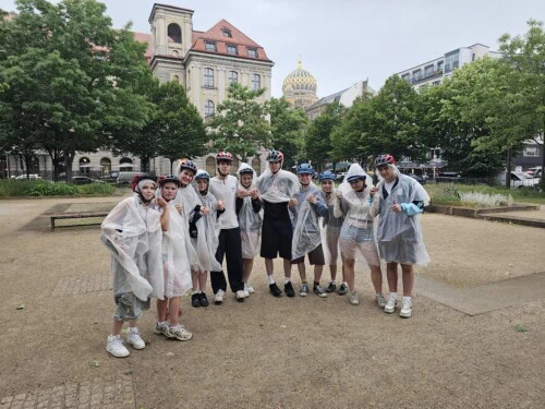 students in rain ponchos