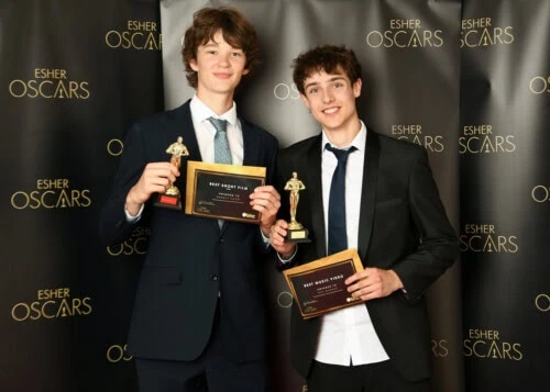 two make winners holding a trophy at the esher oscars