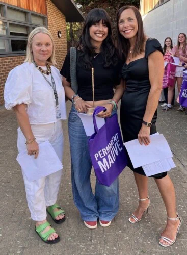 student Luna poses with her Fine Art teachers 2026