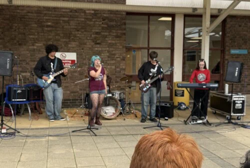 students in a band in the courtyard