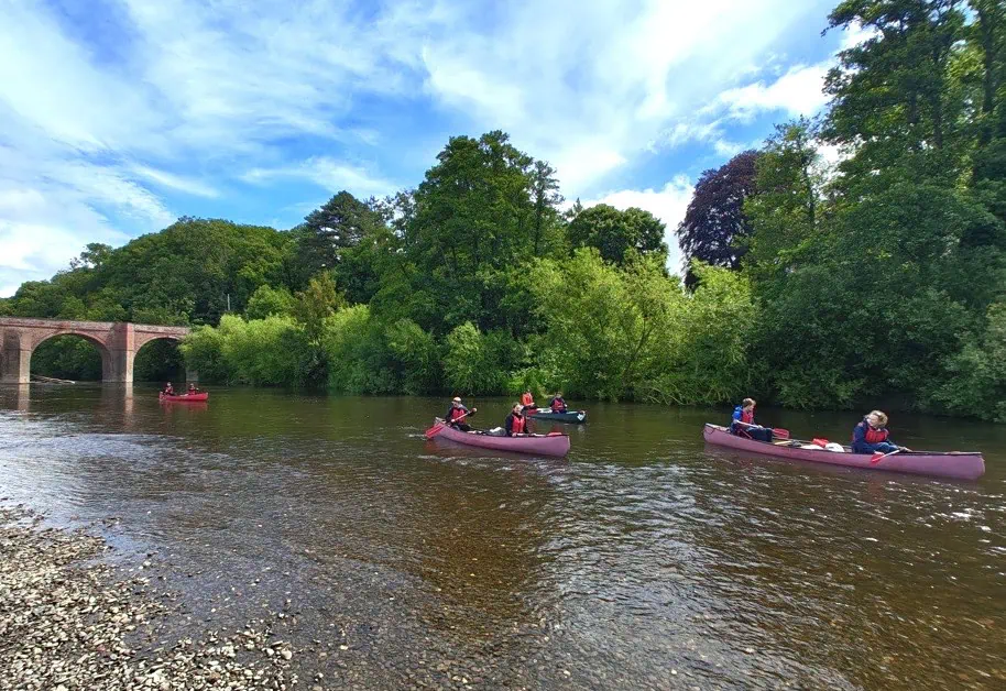 students canoeing on the river wye