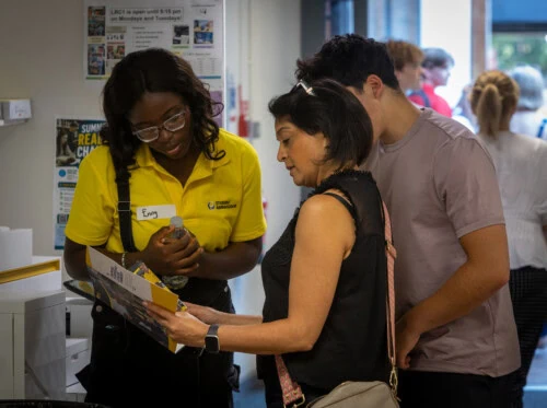 student ambassador helping at open evening